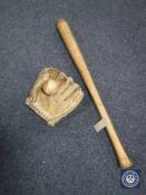 A wooden Worth Robinson baseball bat together with a leather Regent pro model catchers mitt and a