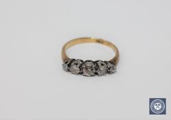 An 18ct gold five stone diamond ring.