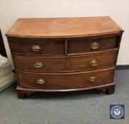 A George III mahogany bow fronted four drawer chest,