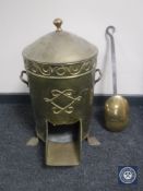 A brass lidded stove and a toasting shovel