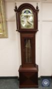 A contemporary mahogany longcased clock with brass moonphase dial, pendulum and weights,