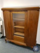 A continental glazed oak sideboard, width 137 cm.