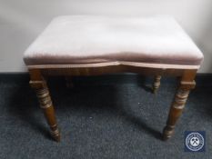 An early 20th century mahogany dressing table stool