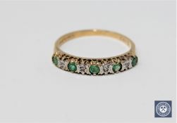 A 9ct gold gem set half eternity ring.