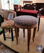 A circular oak footstool,