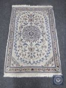 A Nain design rug on ivory ground,
