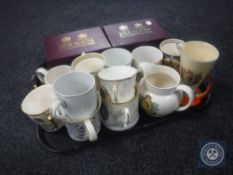 A tray of commemorative mugs and jugs,