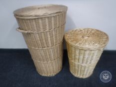 Two wicker lidded laundry baskets