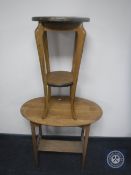 An Edwardian oak circular two tier plant stand and a table