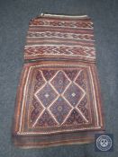 An antique kilim flat weave saddle rug,