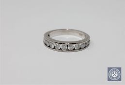 A 14ct gold twelve stone diamond half eternity ring, round brilliant cut stones approximately 1ct,