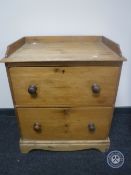 A Victorian pine two drawer chest CONDITION REPORT: 65cm wide by 43cm deep by 77cm