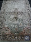 A carpet of Tabriz design, on pale-mint ground,