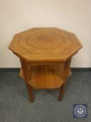 An oak inlaid two tier occasional table, width 56.