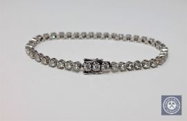 A 14ct white gold diamond tennis bracelet, featuring 42 round brilliant cut white diamonds 3.47ct.