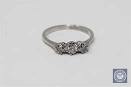 An 18ct white gold three stone diamond ring, approximately 1ct, size N.