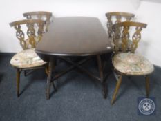 An Ercol drop leaf table together with four chairs