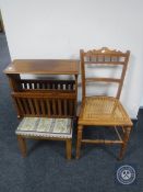 An Edwardian oak bergere seated bedroom chair together with a tapestry upholstered stool and a