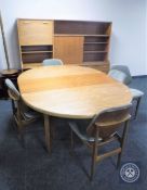 A 1970's seven-piece teak dining room suite