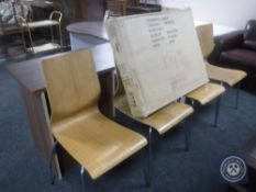 A set of four kitchen chairs on metal legs together with a boxed Cherwell table