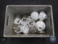 A box of oil lamp chimneys and glass shades