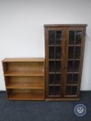 An oak double door bookcase together with a set of mid 20th century teak bookshelves