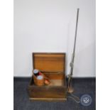 A mahogany storage box, long brass horn, leather cased binoculars,