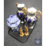 A pair of ornate Majolica style twin handled vases, pair of Japanese figures,