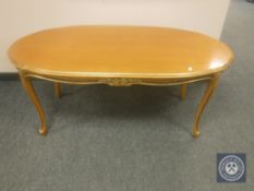 A reproduction gilt highlighted coffee table,