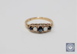 A 9ct gold sapphire and opal set ring, size I 1/2.