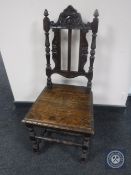 A carved oak hall chair