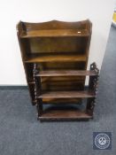 An oak wall shelf together with a set of oak open bookshelves