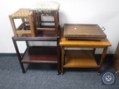 A teak turnover top tea trolley together with a two tier oak tea trolley,