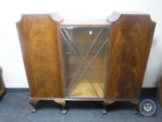 A mahogany Art Deco display cabinet on claw and ball feet