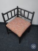 An early 20th century bobbin corner chair