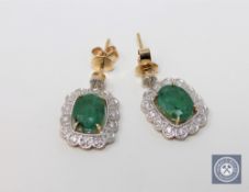 A pair of 14ct yellow gold emerald and diamond earrings featuring 2 cushion cut emeralds 3.