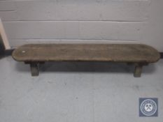 An antique rustic pine low bench