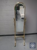 A brass framed cheval mirror