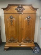 A 19th century oak and burr walnut double door cabinet,