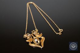 An 18ct gold Art Nouveau style diamond set pendant, the total diamond weight estimated at 0.