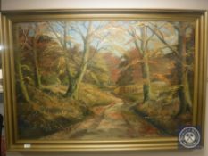 A continental oil on cans depicting a woodland track, 115 cm x 75 cm , framed.