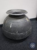 An antique bronze cooking pot