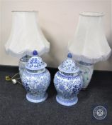 A pair of Chinese style pottery table lamps with shades together with a pair of blue and white