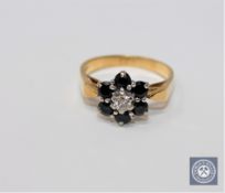 An 18ct gold sapphire and diamond cluster ring