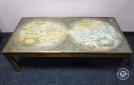 A brass topped coffee table depicting a map of the world CONDITION REPORT: 132cm