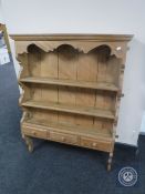 A wall mounted pine plate rack fitted three drawers CONDITION REPORT: 112cm high by