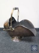 A Victorian copper coal helmet