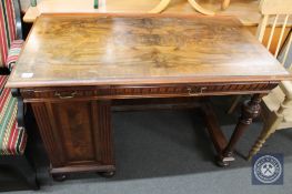 A 19th century continental walnut single pedestal writing desk