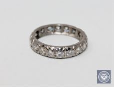 A diamond full eternity ring in white metal, approximately 1ct.