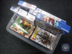 A box of Marvel Collector's Edition comics and five Marvel jigsaws